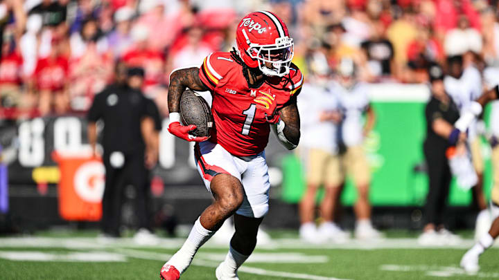 Oct 4, 2025; College Park, Maryland, USA;  Maryland Terrapins wide receiver Jalil Farooq (1) carries the ball against the Washington Huskies at SECU Stadium. Mandatory Credit: Jamie Sabau-Imagn Images