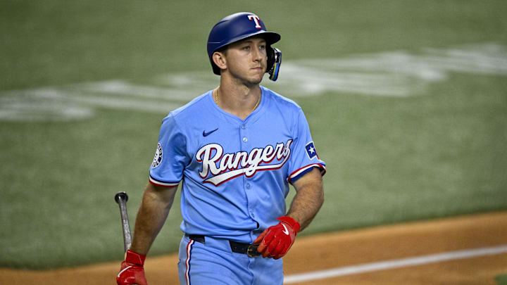 Sep 22, 2024; Arlington, Texas, USA; Texas Rangers left fielder Wyatt Langford (36) walks back to the dugout after he strikes out during the fourth inning against the Seattle Mariners at Globe Life Field.