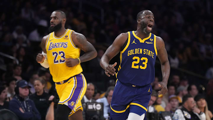 Golden State Warriors forward Draymond Green and Los Angeles Lakers forward LeBron James.