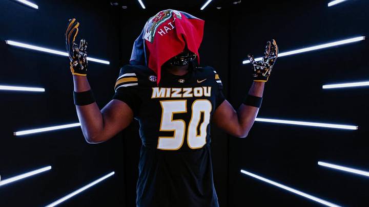DeMatha Catholic defensive lineman Sean Saint Fleur poses with a Haitian flag on his official visit to the University of Missouri. DeMatha Catholic defensive lineman Sean Saint Fleur poses with a Haitian flag on his official visit to the University of Missouri.