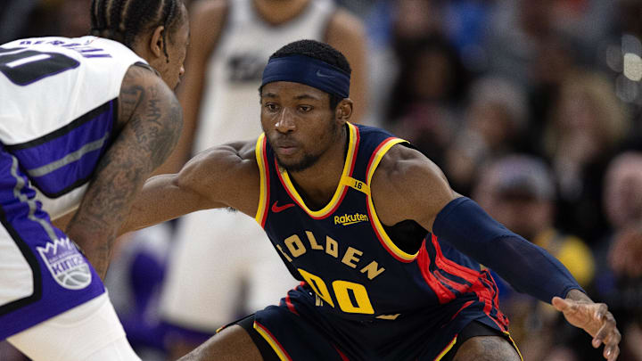 Mar 13, 2025; San Francisco, California, USA; Golden State Warriors forward Jonathan Kuminga (00) guards Sacramento Kings guard DeMar DeRozan (10) during the third quarter at Chase Center. Mandatory Credit: D. Ross Cameron-Imagn Images