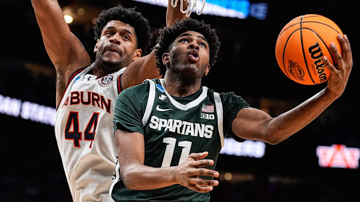Michigan State guard Jase Richardson (11) goes to the basket against Auburn center Dylan Cardwell (44) during the second half of the Elite Eight round of NCAA tournament at State Farm Arena in Atlanta, Ga. on Sunday, March 30, 2025.