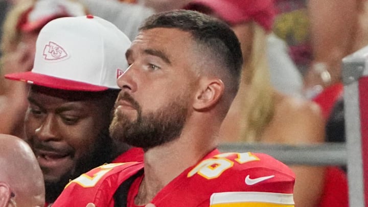Aug 22, 2025; Kansas City, Missouri, USA; Kansas City Chiefs tight end Travis Kelce (87) watches play against the Chicago Bears during the second half of the game at GEHA Field at Arrowhead Stadium.
