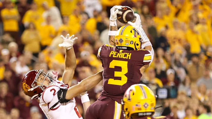 Oct 5, 2024; Minneapolis, Minnesota, USA; Minnesota Golden Gophers defensive back Koi Perich (3) intercepts a pass during the second half against the USC Trojans at Huntington Bank Stadium. Mandatory Credit: Matt Krohn-Imagn Images