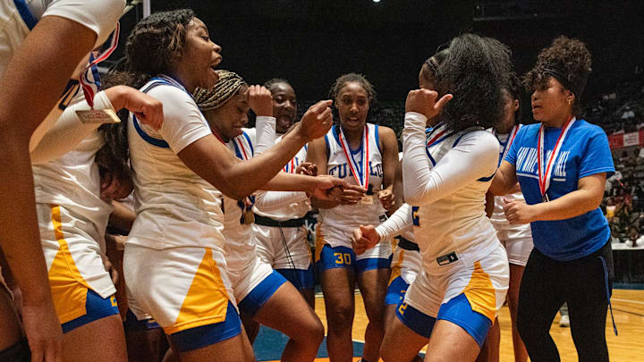 Tupelo Lady Wave's players celebrate after winning the MHSAA Class 7A state final game against the Germantown Lady Mavericks at the Mississippi Coliseum in Jackson, Miss., on Saturday, Mar. 2, 2024.