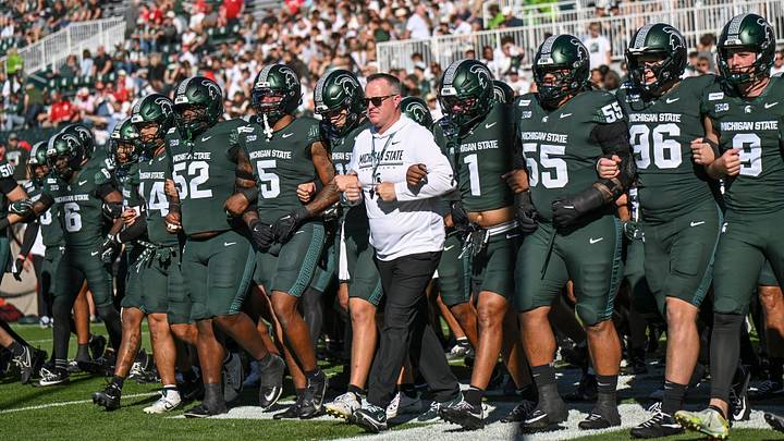 Michigan State’s head coach Pat Fitzgerald, center, walks the end zone with the team before the football game against Nebraska on Saturday, Sept. 26, 2026, in East Lansing. Michigan State’s head coach Pat Fitzgerald, center, walks the end zone with the team before the football game against Nebraska on Saturday, Sept. 26, 2026, in East Lansing.