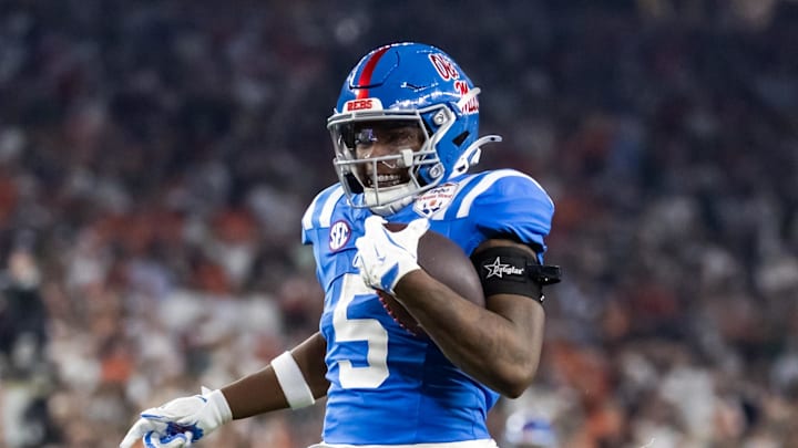 Jan 8, 2026; Glendale, AZ, USA; Mississippi Rebels running back Kewan Lacy (5) runs for a touchdown against the Miami Hurricanes during the 2026 Fiesta Bowl and semifinal game of the College Football Playoff at State Farm Stadium. Mandatory Credit: Mark J. Rebilas-Imagn Images Jan 8, 2026; Glendale, AZ, USA; Mississippi Rebels running back Kewan Lacy (5) runs for a touchdown against the Miami Hurricanes during the 2026 Fiesta Bowl and semifinal game of the College Football Playoff at State Farm Stadium. Mandatory Credit: Mark J. Rebilas-Imagn Images
