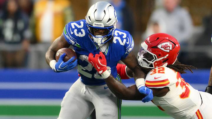 Oct 25, 2026; Seattle, Washington, USA; Seattle Seahawks running back Emanuel Wilson (23) carries the ball defended by Kansas City Chiefs linebacker Nick Bolton (32) during the second quarter at Lumen Field. Mandatory Credit: Steven Bisig-Imagn Images Oct 25, 2026; Seattle, Washington, USA; Seattle Seahawks running back Emanuel Wilson (23) carries the ball defended by Kansas City Chiefs linebacker Nick Bolton (32) during the second quarter at Lumen Field. Mandatory Credit: Steven Bisig-Imagn Images