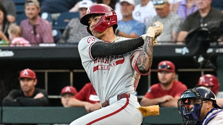 Arkansas Razorbacks shortstop Wehiwa Aloy singles against the LSU Tigers during the eighth inning at Charles Schwab Field on Wednesday at the College World Series.