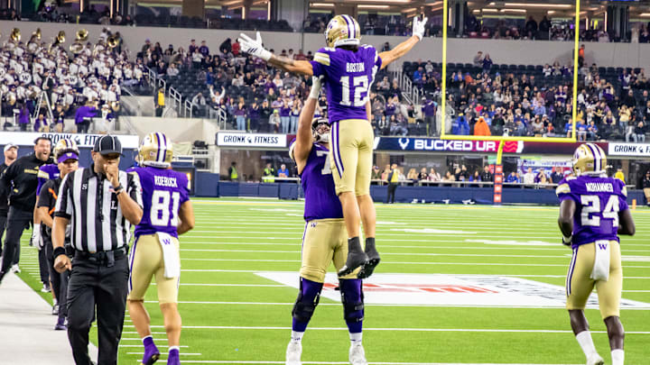 Denzel Boston gets a celebratory lift from tackle Drew Azzopardi after his 78-yard touchdown catch in the LA Bowl.