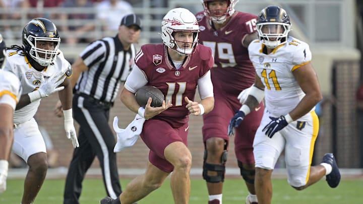 Sep 20, 2025; Tallahassee, Florida, USA; Florida State Seminoles quarterback Brock Glenn (11) runs the ball during the second half against the Kent State Golden Flashes at Doak S. Campbell Stadium. Mandatory Credit: Melina Myers-Imagn Images