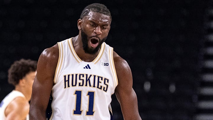 Washington Huskies center Franck Kepnang (11) celebrates a defensive play during the second half of their game in the Acrisure Series in Palm Desert, Calif., Thursday, Nov. 27, 2025.