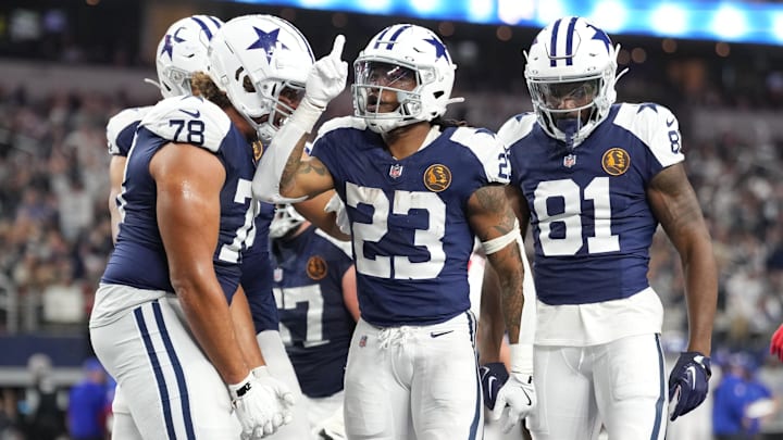 Dallas Cowboys running back Rico Dowdle (23) celebrates with teammates after scoring a touchdown against the New York Giants during the second half at AT&T Stadium.