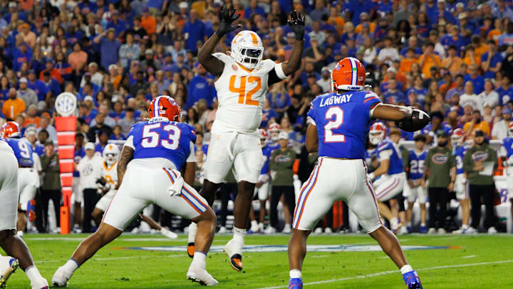 Nov 22, 2025; Gainesville, Florida, USA; Tennessee Volunteers defensive lineman Tyre West (42) attempts to block a pass from Florida Gators quarterback DJ Lagway (2) during the first half at Ben Hill Griffin Stadium. Mandatory Credit: Matt Pendleton-Imagn Images