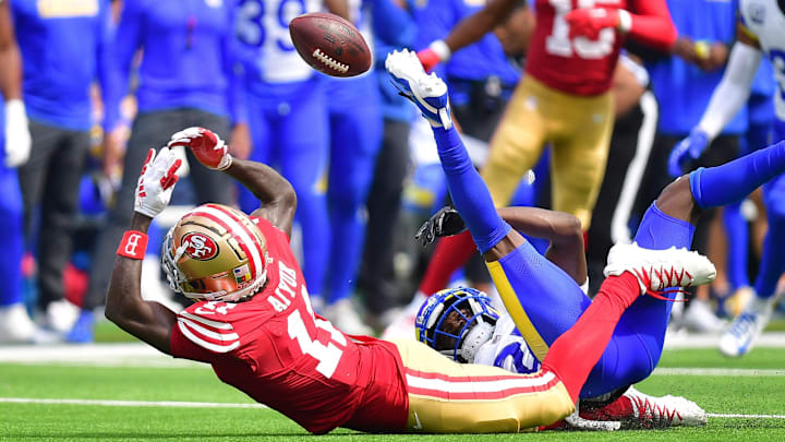 Sep 22, 2024; Inglewood, California, USA; San Francisco 49ers wide receiver Brandon Aiyuk (11) misses catching a pass against the defense of Los Angeles Rams cornerback Tre'Davious White (27) during the first half at SoFi Stadium. Mandatory Credit: Gary A. Vasquez-Imagn Images