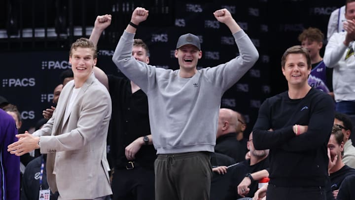 Apr 10, 2026; Salt Lake City, Utah, USA; Utah Jazz forward Lauri Markkanen and center Walker Kessler and head coach Will Hardy react after Utah Jazz guard John Konchar completes a triple double against the Memphis Grizzlies during the second half at Delta Center. Mandatory Credit: Rob Gray-Imagn Images