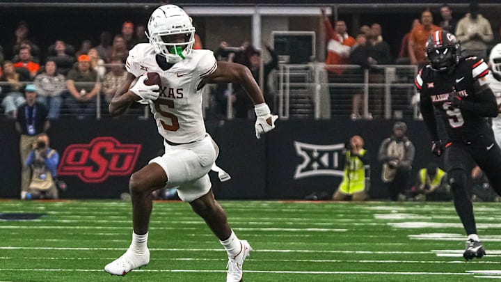 Texas Longhorns wide receiver Adonai Mitchell (5) runs the ball during the Big 12 Championship game against the Oklahoma State Cowboys at AT&T stadium on Saturday, Dec. 2, 2023 in Arlington.