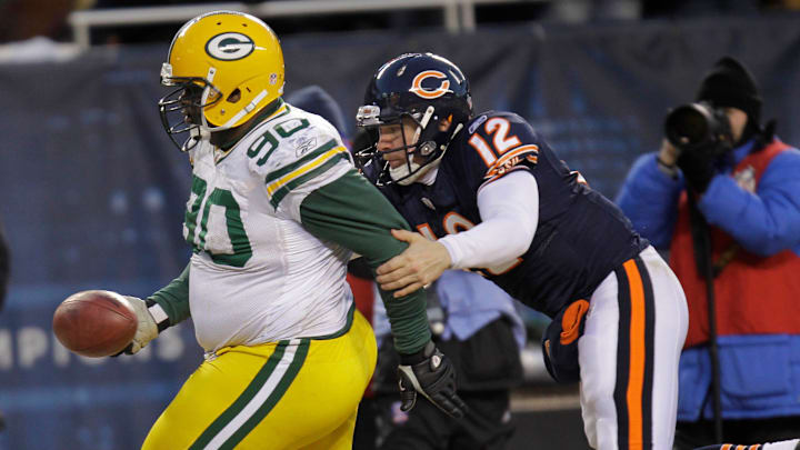 Green Bay Packers defensive tackle B.J. Raji scores on a pick-6 as Bears QB Caleb Hanie tries for the tackle in the 2010 NFC Championship Game.