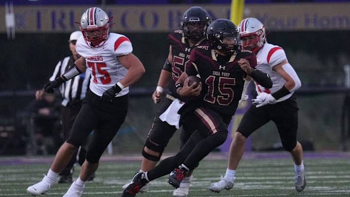 Quarterback Julian Guzman (15) runs the ball for Iona Prep in its season opener against Somers on Sept. 6.