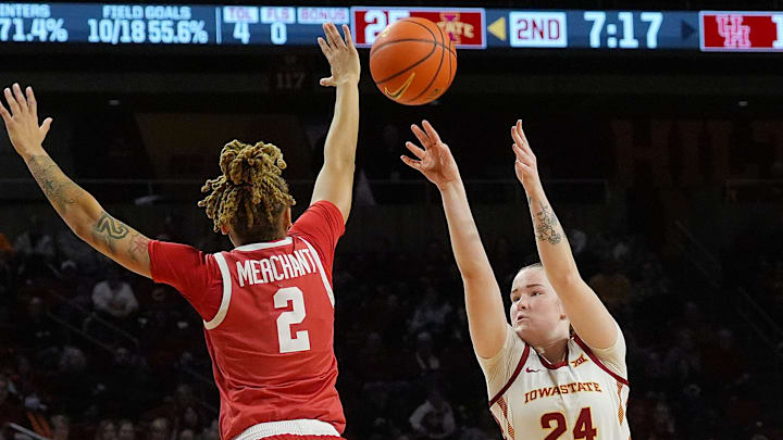 Iowa State Cyclones' forward Addy Brown (24) takes a three-point shot over Houston Cougars guard Kierra Merchant (2) during the second quarter in the Big-12 women’s basketball at Hilton Coliseum on Wednesday, Feb19, 2025, in Ames, Iowa.