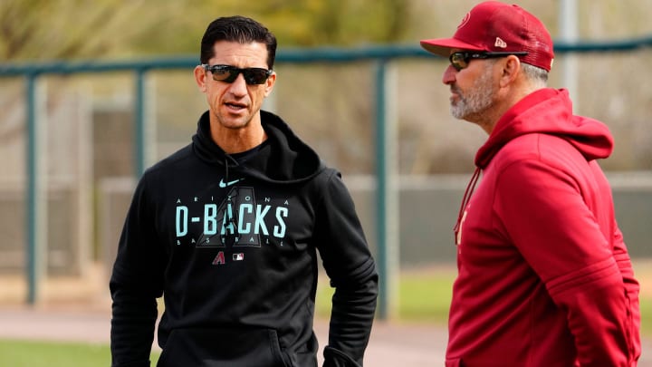 Arizona Diamondbacks general manager Mike Hazen talks to manager Torey Lovullo during spring training workouts at Salt River Fields in Scottsdale on Feb. 17, 2023.