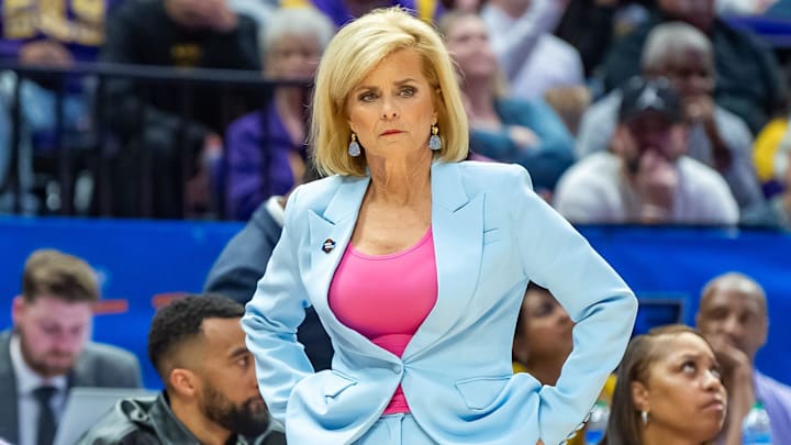 LSU coach Kim Mulkey watches as the defending national champion Tigers hold on for a win against Rice.