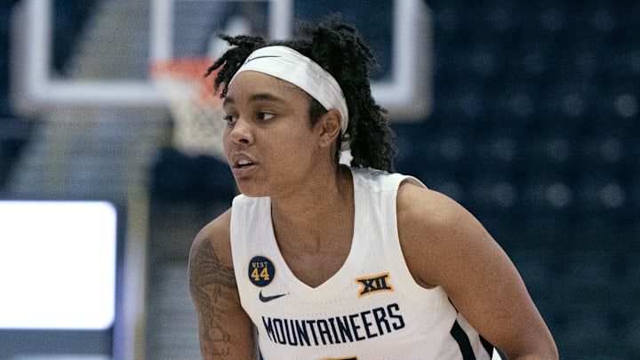 Dec 1, 2024; Estero, FL, USA; West Virginia University Sydney Shaw (5) looks to make a pass in the first quarter of the Women's Gulf Coast Showcase at Hertz Arena. Mandatory Credit: Chris Tilley-Imagn Images
