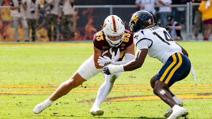 West Virginia Mountaineers Kekoura Tarnue (14) attempts to block Arizona State Sun Devils Derek Eusebio (83) during a game at Mountain America Stadium in Tempe on Nov. 15, 2025.