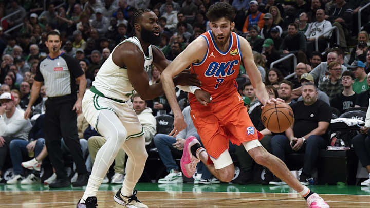 Apr 3, 2024; Boston, Massachusetts, USA; Oklahoma City Thunder forward Chet Holmgren (7) controls the ball while Boston Celtics guard Jaylen Brown (7) defends during the first half at TD Garden. Mandatory Credit: Bob DeChiara-USA TODAY Sports Apr 3, 2024; Boston, Massachusetts, USA; Oklahoma City Thunder forward Chet Holmgren (7) controls the ball while Boston Celtics guard Jaylen Brown (7) defends during the first half at TD Garden. Mandatory Credit: Bob DeChiara-USA TODAY Sports