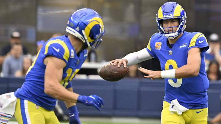 Oct 16, 2022; Inglewood, California, USA; Los Angeles Rams quarterback Matthew Stafford (9) looks to pass the ball to wide receiver Cooper Kupp (10) during the first quarter against the Carolina Panthers at SoFi Stadium. Mandatory Credit: Robert Hanashiro-Imagn Images