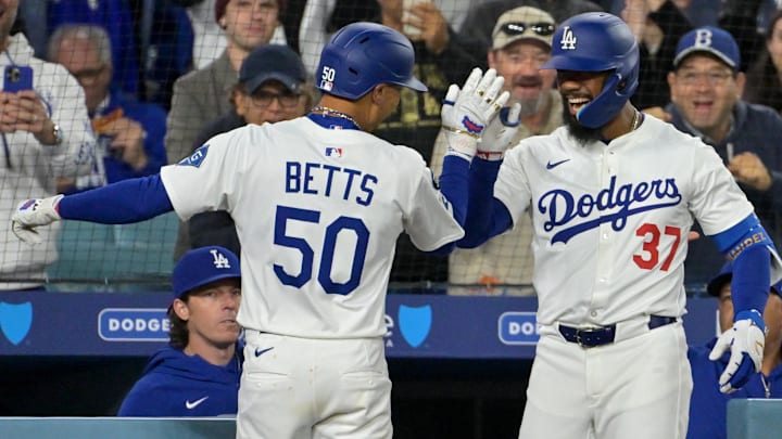 Apr 1, 2025; Los Angeles, California, USA; Los Angeles Dodgers shortstop Mookie Betts (50) is congratulated by left fielder Teoscar Hernandez (37) after hitting a two run home run in the sixth inning against the Atlanta Braves at Dodger Stadium. Mandatory Credit: Jayne Kamin-Oncea-Imagn Images Apr 1, 2025; Los Angeles, California, USA; Los Angeles Dodgers shortstop Mookie Betts (50) is congratulated by left fielder Teoscar Hernandez (37) after hitting a two run home run in the sixth inning against the Atlanta Braves at Dodger Stadium. Mandatory Credit: Jayne Kamin-Oncea-Imagn Images