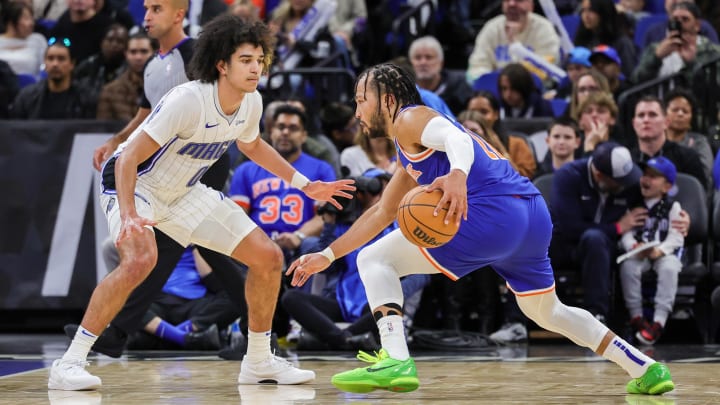 Orlando Magic guard Anthony Black (0) defends New York Knicks guard Jalen Brunson (11) during the second half at KIA Center. Orlando Magic guard Anthony Black (0) defends New York Knicks guard Jalen Brunson (11) during the second half at KIA Center.