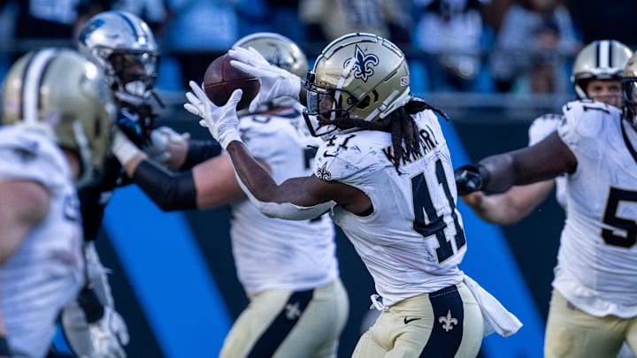 Nov 3, 2024; Charlotte, North Carolina, USA; New Orleans Saints running back Alvin Kamara (41) pulls in a pass during the fourth quarter against the Carolina Panthers at Bank of America Stadium. Mandatory Credit: Scott Kinser-Imagn Images