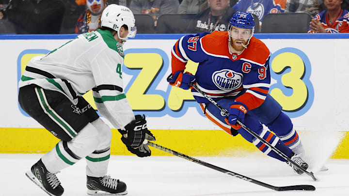 May 29, 2024; Edmonton, Alberta, CAN; Edmonton Oilers forward Connor McDavid (97) makes a move on Dallas Stars defensemen Miro Heiskanen (4) during the third period in game four of the Western Conference Final of the 2024 Stanley Cup Playoffs at Rogers Place. Mandatory Credit: Perry Nelson-USA TODAY Sports