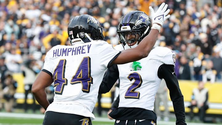 Baltimore Ravens cornerback Marlon Humphrey celebrates with cornerback Nate Wiggins.