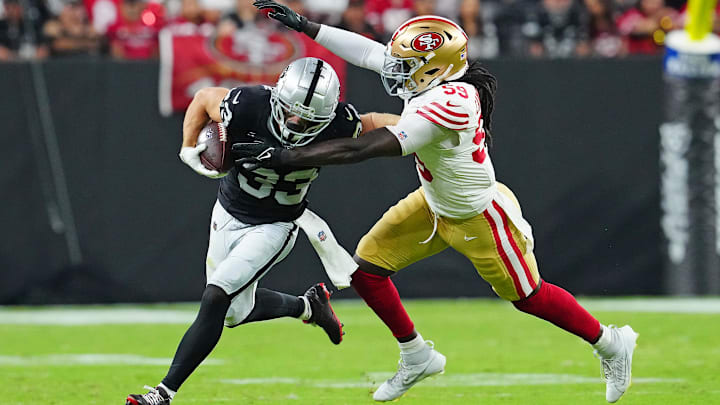 Aug 23, 2024; Paradise, Nevada, USA; San Francisco 49ers linebacker De'Vondre Campbell (59) looks to tackle Las Vegas Raiders wide receiver Alex Bachman (33) during the second quarter at Allegiant Stadium. Mandatory Credit: Stephen R. Sylvanie-Imagn Images