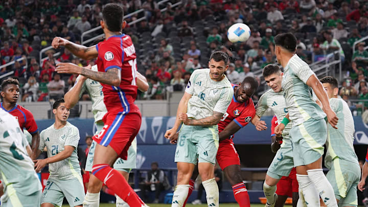 Mexico midfielder Luis Chavez goes for the header  during...