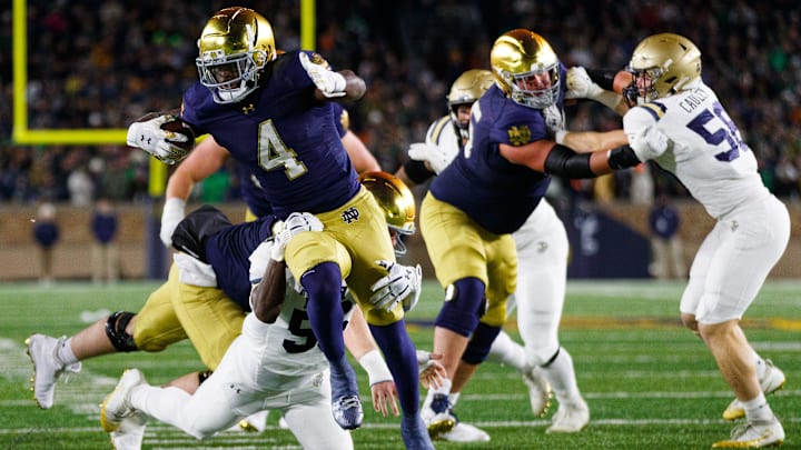 Notre Dame running back Jeremiyah Love (4) runs with the ball during the first half of a NCAA football game against Navy at Notre Dame Stadium on Saturday, Nov. 8, 2025, in South Bend.