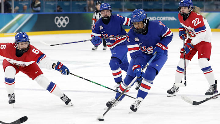 [US, Mexico & Canada customers only] Feb 5, 2026, ITALY;  Laila Edwards (10) of Team United States battles for the puck with Linda Vocetkova (6) of Team Czechia in women's ice hockey Group A play during the Milano Cortina 2026 Olympic Winter Games at Milano Rho Ice Hockey Arena. Mandatory Credit: David W Cerny/Reuters via Imagn Images