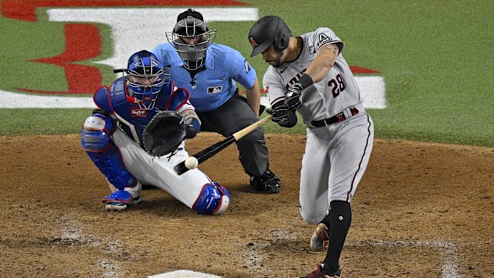 Oct 28, 2023; Arlington, Texas, USA; Arizona Diamondbacks designated hitter Tommy Pham (28) hits a single against the Texas Rangers during the eighth inning in game two of the 2023 World Series at Globe Life Field. Mandatory Credit: Jerome Miron-Imagn Images