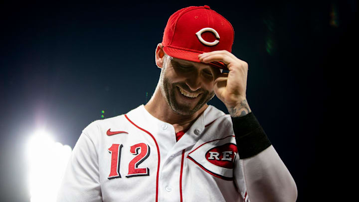 Cincinnati Reds right fielder Tyler Naquin (12) returns to the dugout.