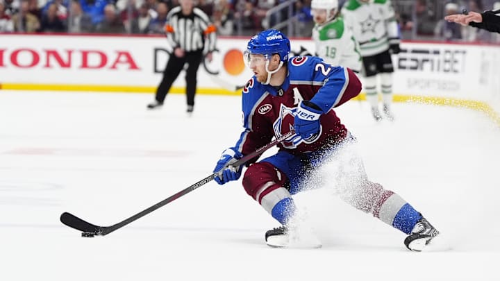 May 1, 2025; Denver, Colorado, USA; Colorado Avalanche center Nathan MacKinnon (29) controls the puck in the second period against the Dallas Stars in game six of the first round of the 2025 Stanley Cup Playoffs at Ball Arena. Mandatory Credit: Ron Chenoy-Imagn Images