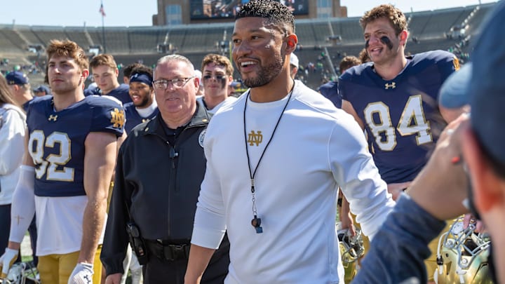 Apr 12, 2025; Notre Dame, IN, USA; Notre Dame Fighting Irish head coach Marcus Freeman smiles as he walks off the field after the Blue-Gold game at Notre Dame Stadium. Apr 12, 2025; Notre Dame, IN, USA; Notre Dame Fighting Irish head coach Marcus Freeman smiles as he walks off the field after the Blue-Gold game at Notre Dame Stadium.