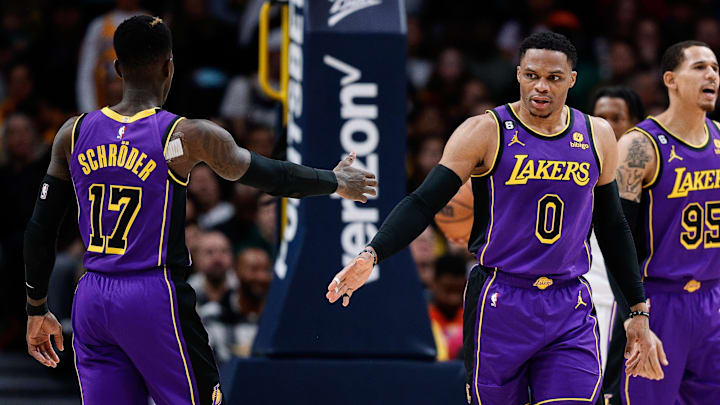 Jan 9, 2023; Denver, Colorado, USA; Los Angeles Lakers guard Russell Westbrook (0) reacts with guard Dennis Schroder (17) in the fourth quarter against the Denver Nuggets at Ball Arena. Mandatory Credit: Isaiah J. Downing-Imagn Images