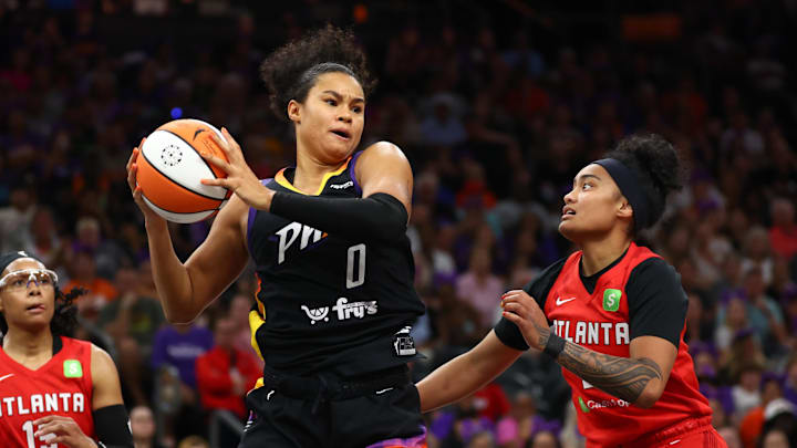Aug 10, 2025; Phoenix, Arizona, USA; Phoenix Mercury forward Satou Sabally (0) against Atlanta Dream guard Te-Hina Paopao (2) at PHX Arena. Mandatory Credit: Mark J. Rebilas-Imagn Images
