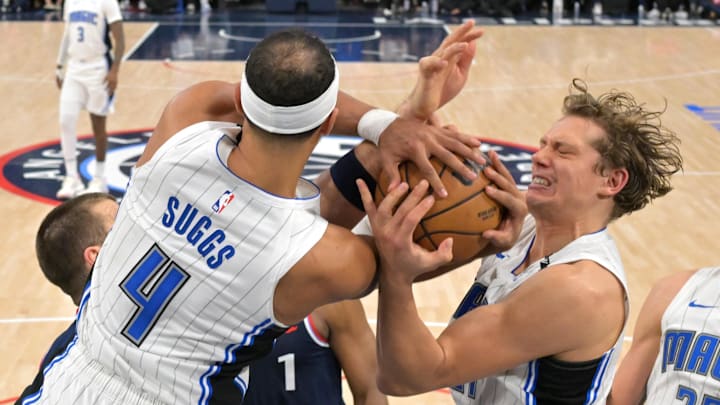 Los Angeles Clippers center Ivica Zubac (40), Orlando Magic guard Jalen Suggs (4) and center Moritz Wagner (21) battle for a rebound in the second half at Intuit Dome.