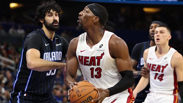 Dec 21, 2024; Orlando, Florida, USA; Miami Heat center Bam Adebayo (13) is guarded by Orlando Magic center Goga Bitadze (35) in the first quarter at Kia Center. Mandatory Credit: Nathan Ray Seebeck-Imagn Images Dec 21, 2024; Orlando, Florida, USA; Miami Heat center Bam Adebayo (13) is guarded by Orlando Magic center Goga Bitadze (35) in the first quarter at Kia Center. Mandatory Credit: Nathan Ray Seebeck-Imagn Images