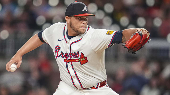 Sep 4, 2024; Cumberland, Georgia, USA; Atlanta Braves pitcher Joe Jimenez (77) pitches against the Colorado Rockies during the eighth inning at Truist Park. Mandatory Credit: Dale Zanine-Imagn Images