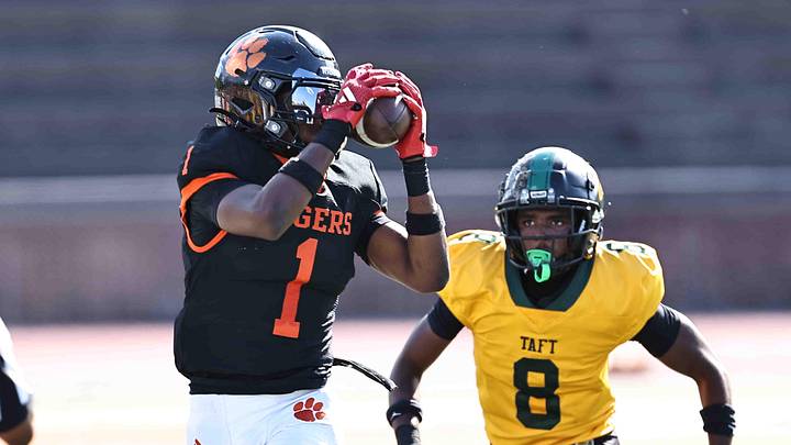 Withrow wide receiver Charles Alexander Jr. (1) catches a pass in front of Taft defensive back Kavontae Whipple (8) during a football game on Saturday, Sept. 27, 2025.