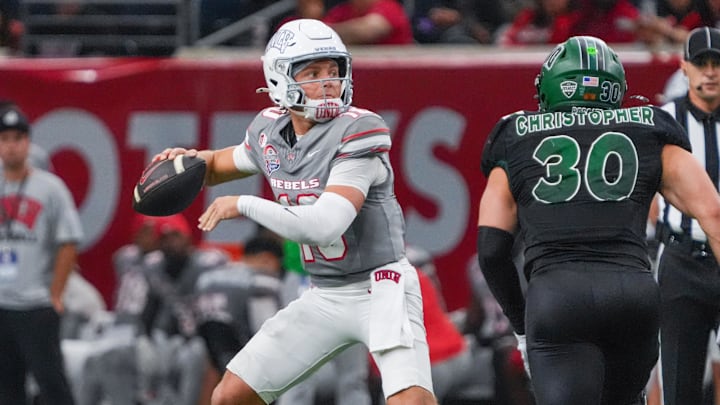 UNLV quarterback Anthony Colandrea stands in the pocket as Ohio linebacker Charlie Christopher defends during the second half of the Frisco Bowl. UNLV quarterback Anthony Colandrea stands in the pocket as Ohio linebacker Charlie Christopher defends during the second half of the Frisco Bowl.